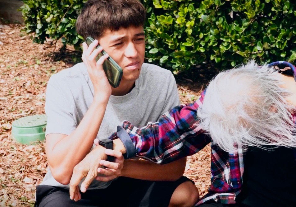 Young person helping elder